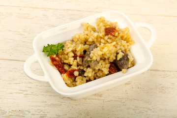 Bulgur with chicken hearts