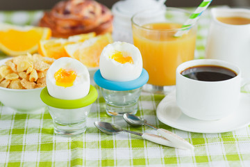 Soft boiled chicken egg, coffee, muesli and orange juice