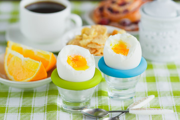 Soft boiled chicken egg, coffee, muesli and orange juice