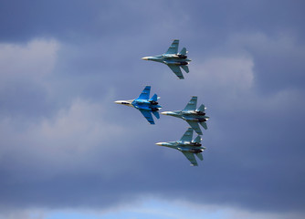 Fighters  flying in a cloudy sky