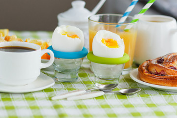 Soft boiled chicken egg, coffee, muesli and orange juice