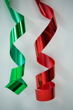 Red And Green Streamers On White Background