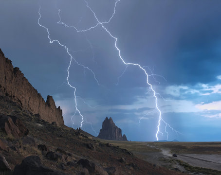 An SUV Races Away from a Thunderstorm at Shiprock, New Mexico
