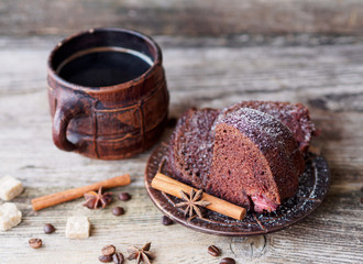 chocolate cupcake with strawberries and coffee mug