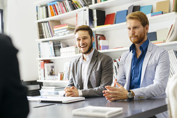 Business colleagues sitting at desk