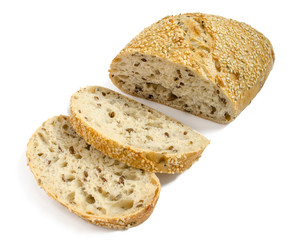 Sesame bread with different seeds and sliced isolated on white background