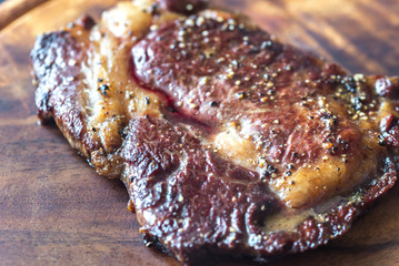 Roasted beef steak on the wooden board