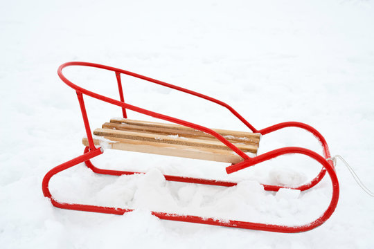 wooden sled on the snow - copy space
