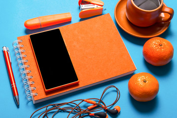 Office desk, stationery on blue background