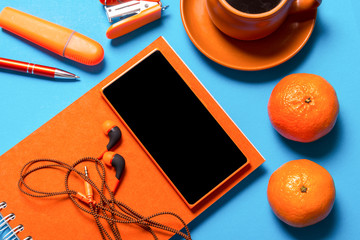 Office desk, stationery on blue background