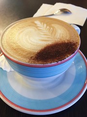 Delicious cappuccino coffee in a beautiful mug 