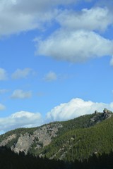 Fototapeta premium Puffy clouds over the Rockies