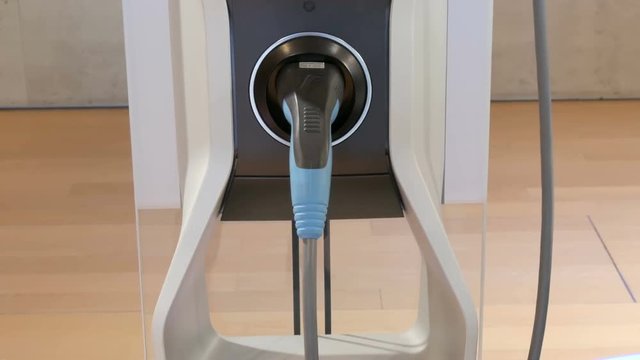 View on the column for refueling electric vehicles and cable. Ecologically clean transport. Portable refueling for electric vehicles
