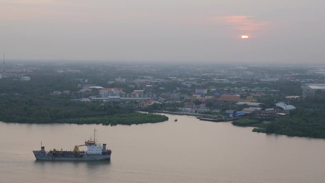 Aerial view of chemical transport tanker ship in Chao Phraya river at sundawn.  Bangkok, Thailand