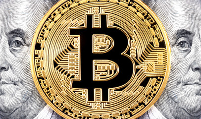 Golden bitcoin with Benjamin Franklin portrait from one hundred american dollars. Business concept of worldwide cryptocurrency