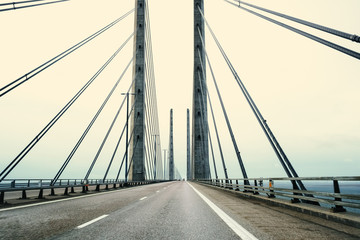 Obraz premium A bridge between Denmark and Sweden early in an autumn morning. A Danish-Swedish detective series of the same name is connected with this bridge. The picture is taken in direction of Denmark.