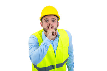 Workman making silence gesture over isolated white background