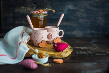 Cup of tea with lemon and heart shaped cookies