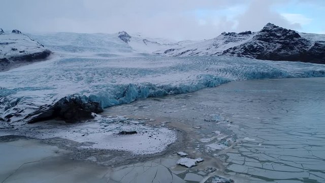 Aerial footage of blue glacier, Fjallsárlón Iceland