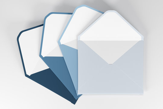 Blue tints envelopes on a white surface
