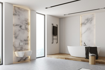 White and marble bathroom corner, toilets