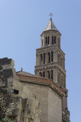 Fototapeta na wymiar Bell tower of Saint Domnius cathedral in Split, with fortified city walls
