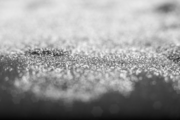 Golden and silver glitter backgound with bokeh abstract blur effect 