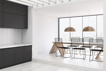 White wooden kitchen and a dining room, gray