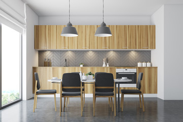 Wooden dining room, black chairs