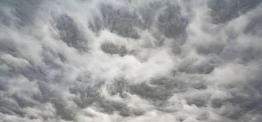 The panorama of overcast texture with clouds. Copy space.A lot of clouds in dramatic filter.