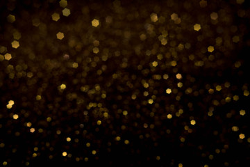Golden and silver glitter backgound with bokeh abstract effect