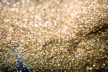Golden and silver glitter backgound with bokeh abstract effect