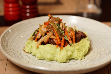 Stewed meat with vegetables and potato mash