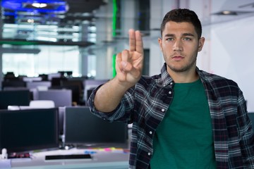 Male executive standing in office