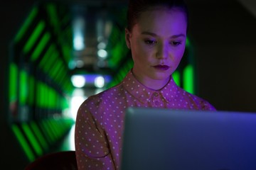 Female executive using laptop