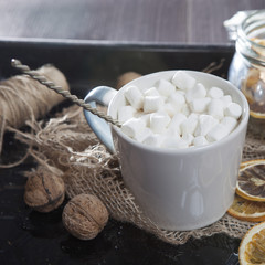 cup with marshmallow with Christmas decorations