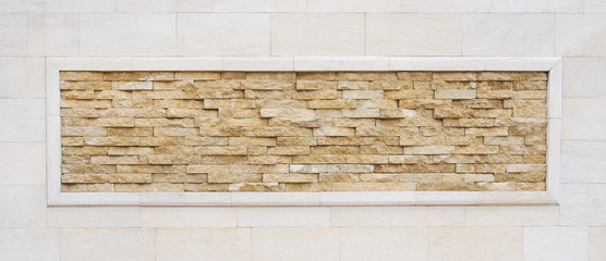 Antique brick wall with natural slim stone frame background. Stone wall texture, slim bricks.