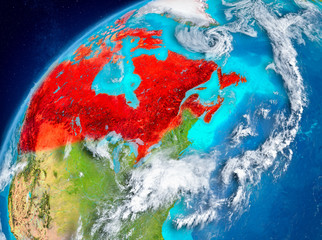 Space view of Canada in red