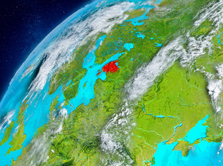 Space view of Estonia in red