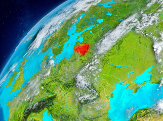Space view of Lithuania in red