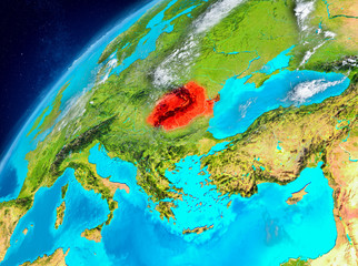 Fototapeta na wymiar Space view of Romania in red
