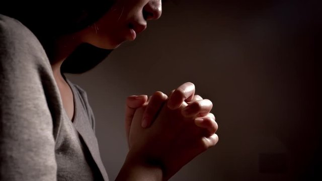 woman pray pious