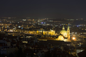 Fototapeta na wymiar Winter night Prague City with St. Nicholas' Cathedral, Czech Republic