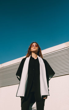 Beautful redhead hip young female model with red sunglasses
