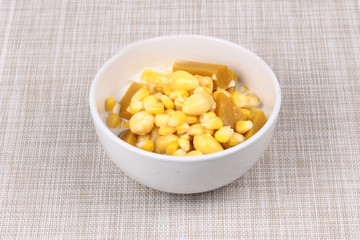 Delicious streamed sweet corn ,pumpkin and ,ginkgo in coconut milk .