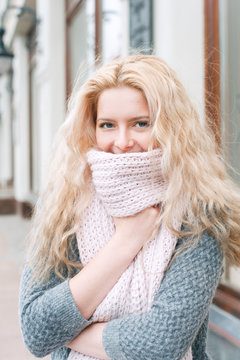 Young woman wrapped in a scarf