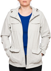 Young woman wearing beige rain jacket isolated on white background