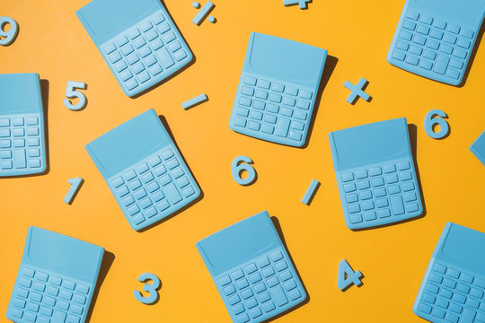 Blue pocket calculators with numbers on orange background.