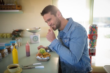 Man having meal in restaurant