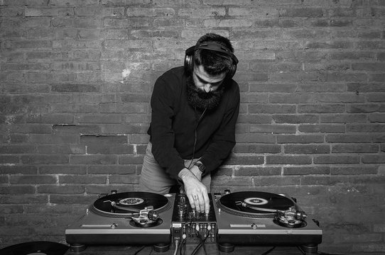 Black and white photo of dj playing